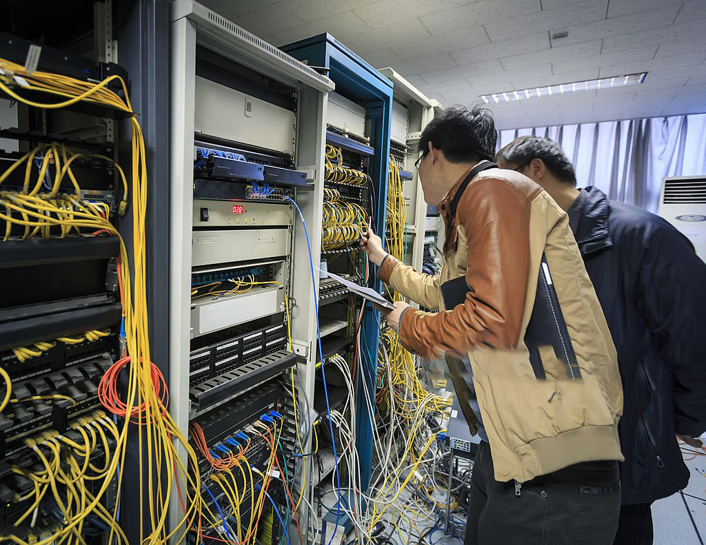 Two IT support managers were working in the server room.